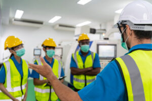 workplace-safety | Abuka health & safety - four men in hard hats and hi vis vests