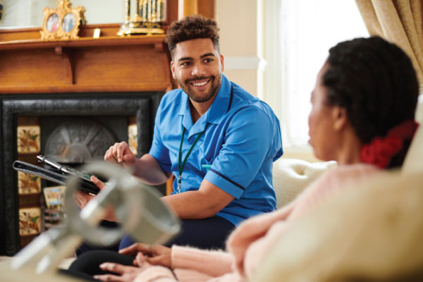 male carer assessing lady